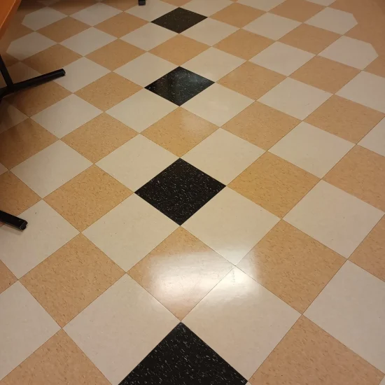 A checkered floor featuring alternating black and white squares arranged in a grid pattern.
